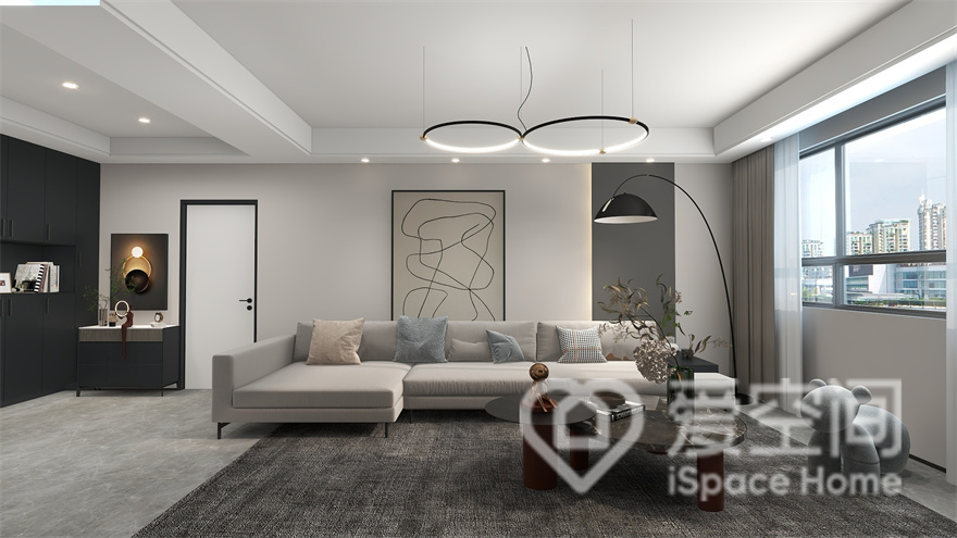 设计师以精炼的极具造型进行融合，打造出一个宁静致远的客厅空间，电视墙的设计塑造出精致的生活氛围。