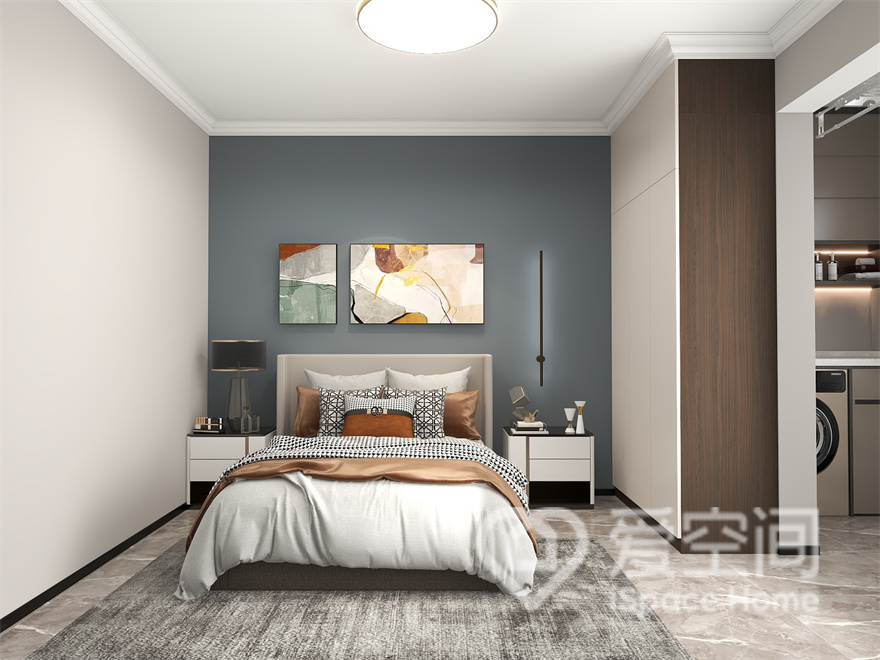 次卧设计简约，选用简朴的蓝色色调做背景，透过家具与软装的组合搭配，呈现出柔和的生活氛围。